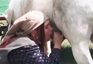 Hick slut is giving a blowjob to a lovely animal